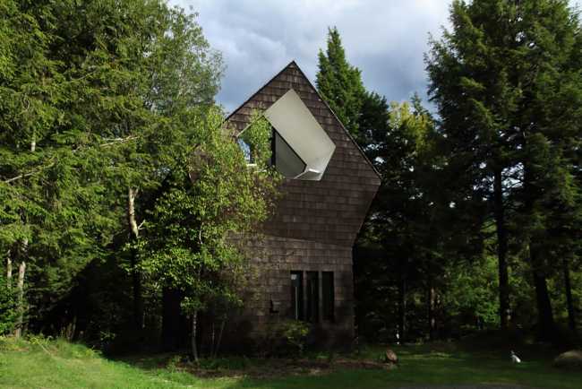 shelter with two sloping roofs in the green